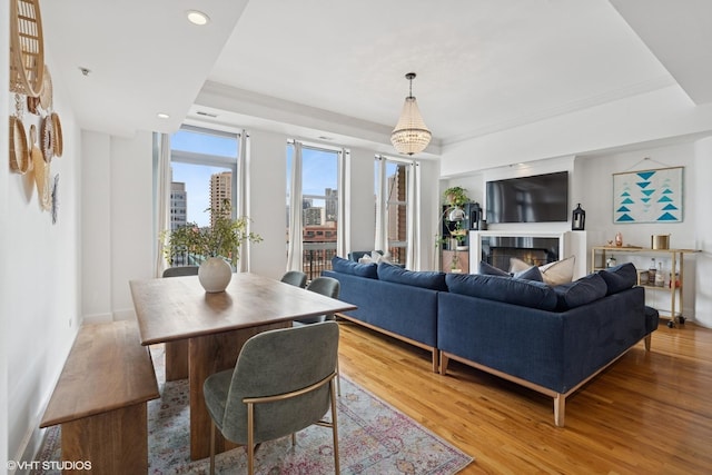 165 N Canal St Unit 906, Chicago, IL 60606 - living area featuring recessed lighting, a warm lit fireplace, light wood-style flooring, and a raised ceiling