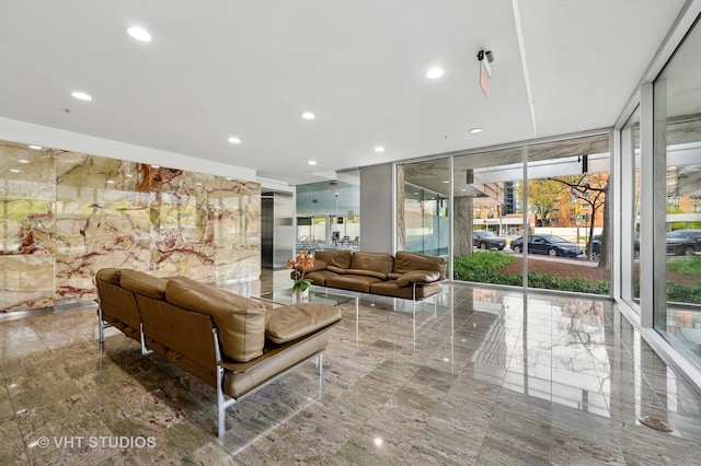 lobby featuring floor to ceiling windows and recessed lighting