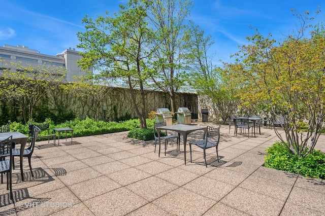 view of patio / terrace featuring outdoor dining area and fence