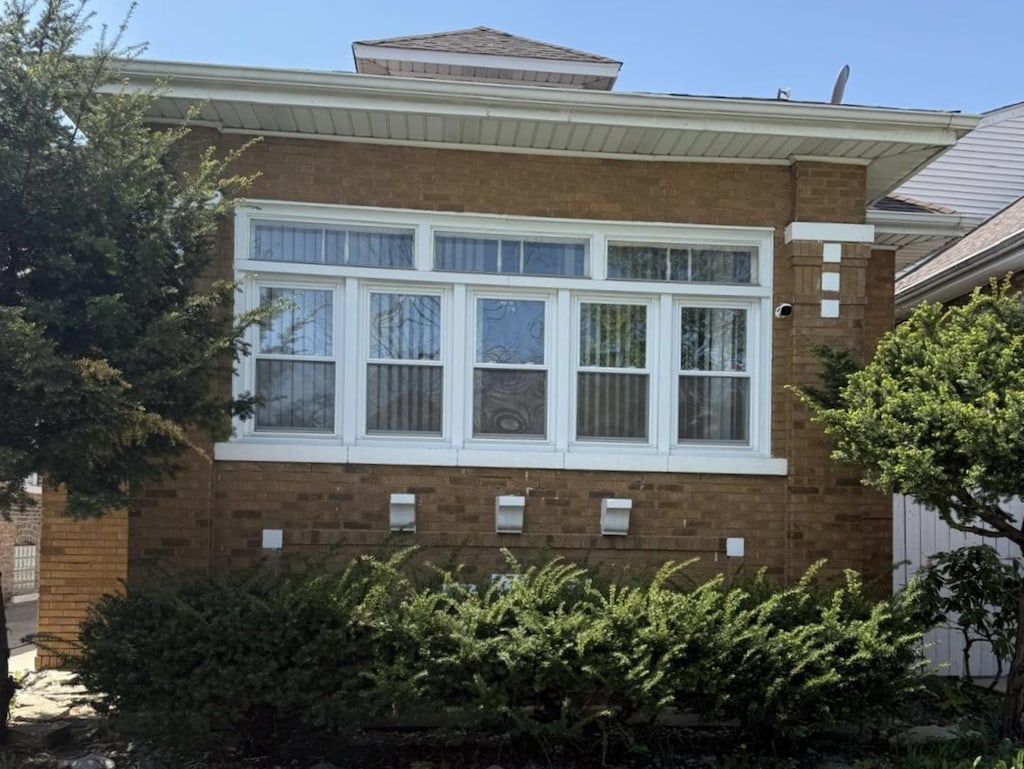 view of home's exterior with brick siding