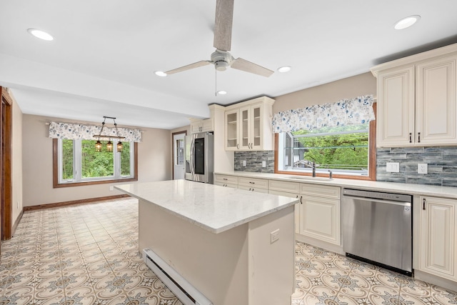 331 E Joliet Hwy, New Lenox, IL 60451 - kitchen featuring stainless steel appliances, baseboard heating, a sink, a center island, and recessed lighting