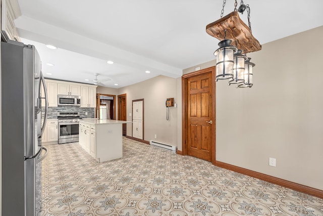 331 E Joliet Hwy, New Lenox, IL 60451 - kitchen with appliances with stainless steel finishes, a baseboard heating unit, a kitchen island, backsplash, and baseboards