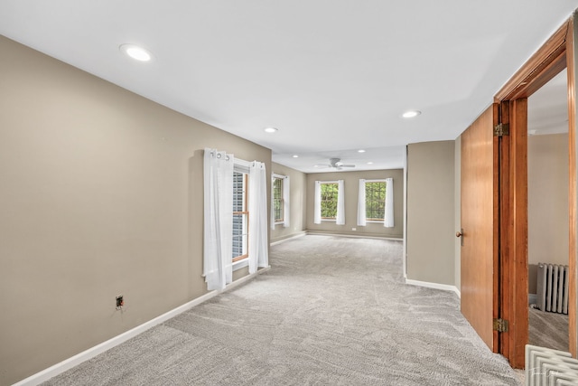 331 E Joliet Hwy, New Lenox, IL 60451 - empty room with radiator heating unit, light carpet, baseboards, recessed lighting, and a ceiling fan