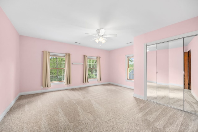 331 E Joliet Hwy, New Lenox, IL 60451 - unfurnished bedroom featuring multiple windows, carpet flooring, baseboards, and a ceiling fan