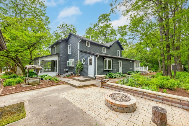 331 E Joliet Hwy, New Lenox, IL 60451 - rear view of property featuring a patio area and a fire pit