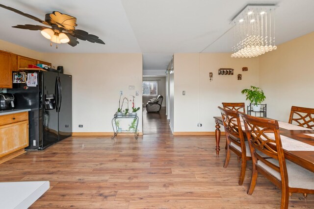 5118 Carol Ln, Gurnee, IL 60031 - dining space with light wood-type flooring, baseboards, and ceiling fan