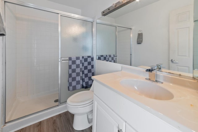 5118 Carol Ln, Gurnee, IL 60031 - bathroom featuring toilet, vanity, wood finished floors, and a stall shower