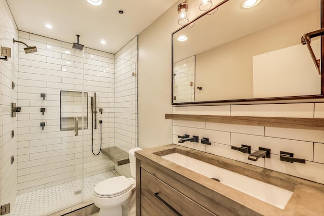 bathroom featuring toilet, recessed lighting, and a stall shower