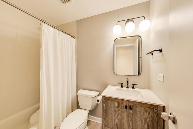 full bathroom with toilet, baseboards, visible vents, and vanity