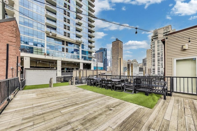 wooden deck featuring a view of city