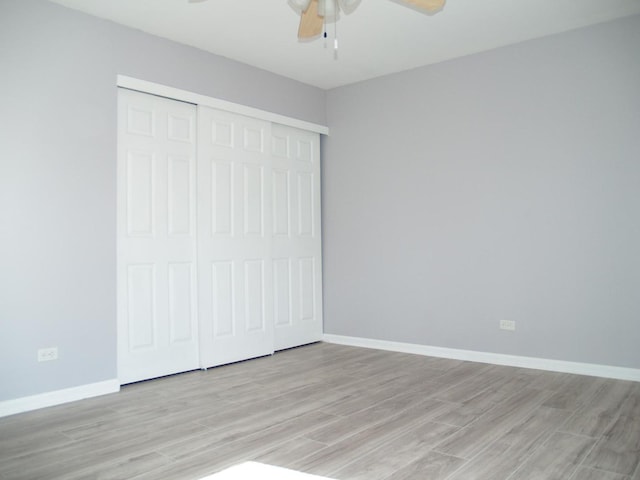 213 Hudson Ct Unit D, Bolingbrook, IL 60440 - unfurnished bedroom with a ceiling fan, baseboards, a closet, and light wood-type flooring