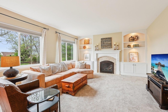 34457 N Bluestem Rd, Round Lake, IL 60073 - carpeted living room featuring a glass covered fireplace and built in features