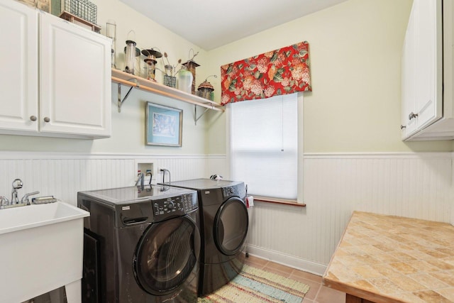 34457 N Bluestem Rd, Round Lake, IL 60073 - laundry room featuring washer and dryer, cabinet space, a sink, a wainscoted wall, and light tile patterned floors