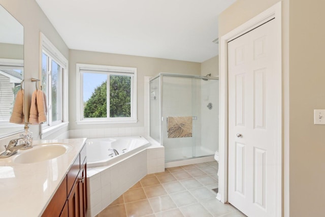 34457 N Bluestem Rd, Round Lake, IL 60073 - bathroom featuring tile patterned floors, a shower stall, a garden tub, and vanity