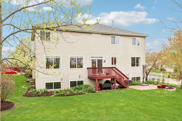 34457 N Bluestem Rd, Round Lake, IL 60073 - rear view of property featuring a wooden deck, stairway, fence, a yard, and a patio