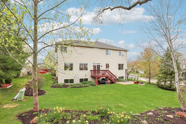34457 N Bluestem Rd, Round Lake, IL 60073 - back of house featuring a yard, a wooden deck, and stairs