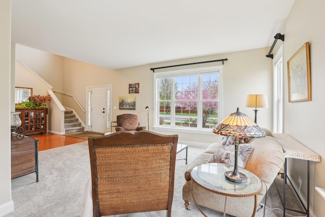 34457 N Bluestem Rd, Round Lake, IL 60073 - living room featuring carpet floors, baseboards, and stairs