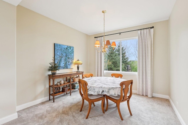 34457 N Bluestem Rd, Round Lake, IL 60073 - dining area with an inviting chandelier, baseboards, and light carpet