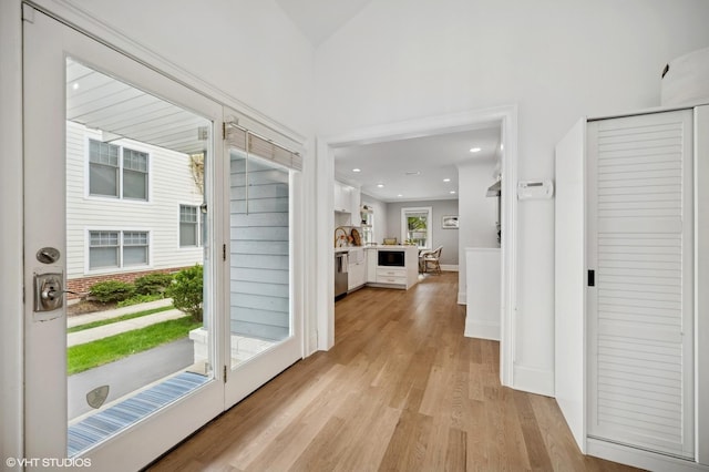 interior space featuring light wood-style flooring and recessed lighting