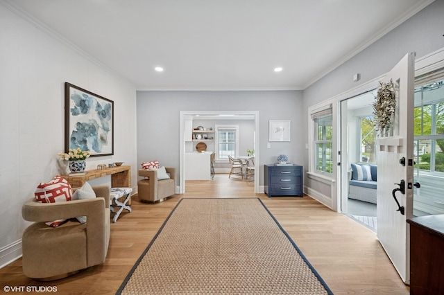 interior space with recessed lighting, light wood finished floors, french doors, and crown molding