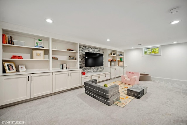 living area with built in shelves, light colored carpet, baseboards, and recessed lighting