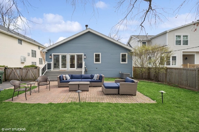 back of house featuring a lawn, outdoor lounge area, central AC, a patio area, and a fenced backyard
