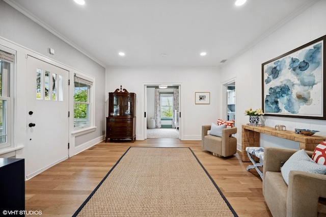 entrance foyer featuring baseboards, recessed lighting, light wood-style flooring, and crown molding