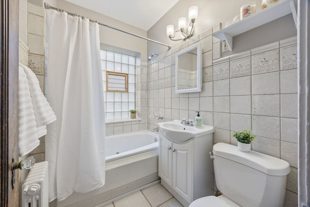 full bath with radiator heating unit, tile walls, toilet, a notable chandelier, and shower / bath combo with shower curtain