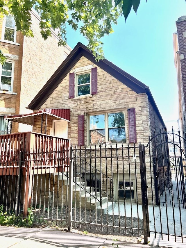 2245 S Homan Ave, Chicago, IL 60623 - view of gate with stairs and a fenced front yard