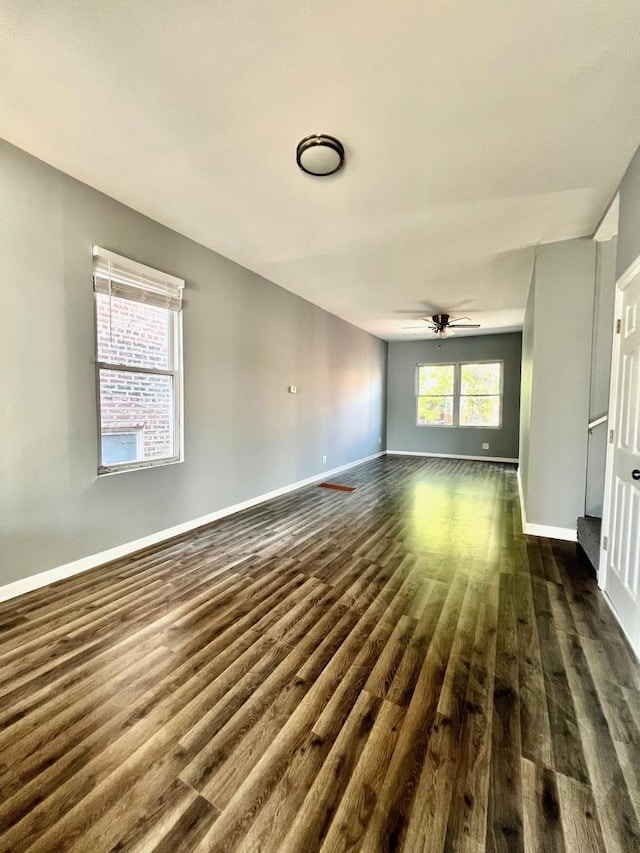 2245 S Homan Ave, Chicago, IL 60623 - unfurnished living room with a ceiling fan, baseboards, and dark wood finished floors