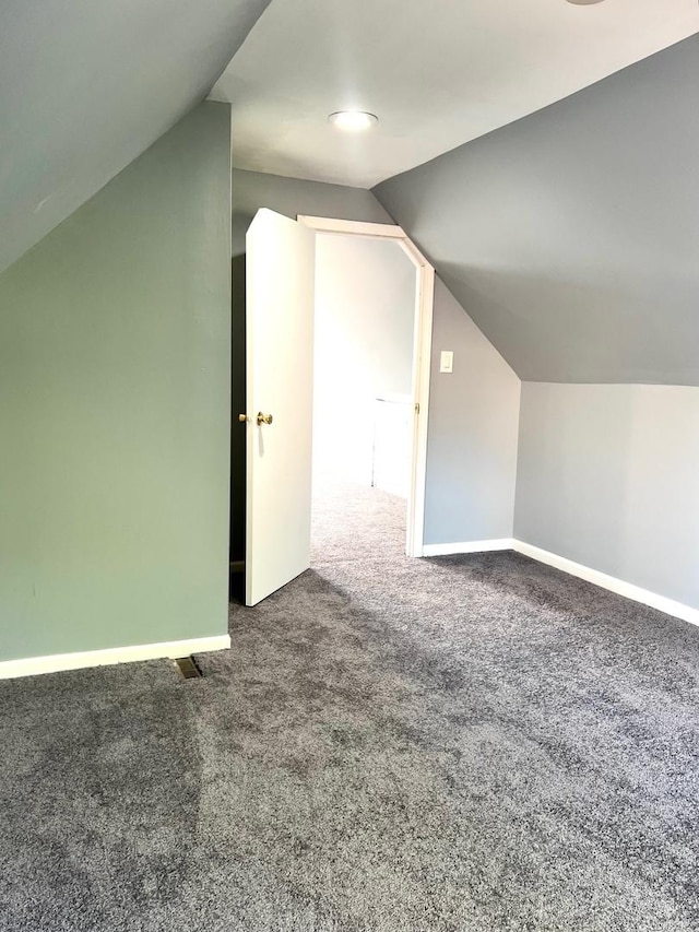 2245 S Homan Ave, Chicago, IL 60623 - additional living space with baseboards, vaulted ceiling, and carpet flooring