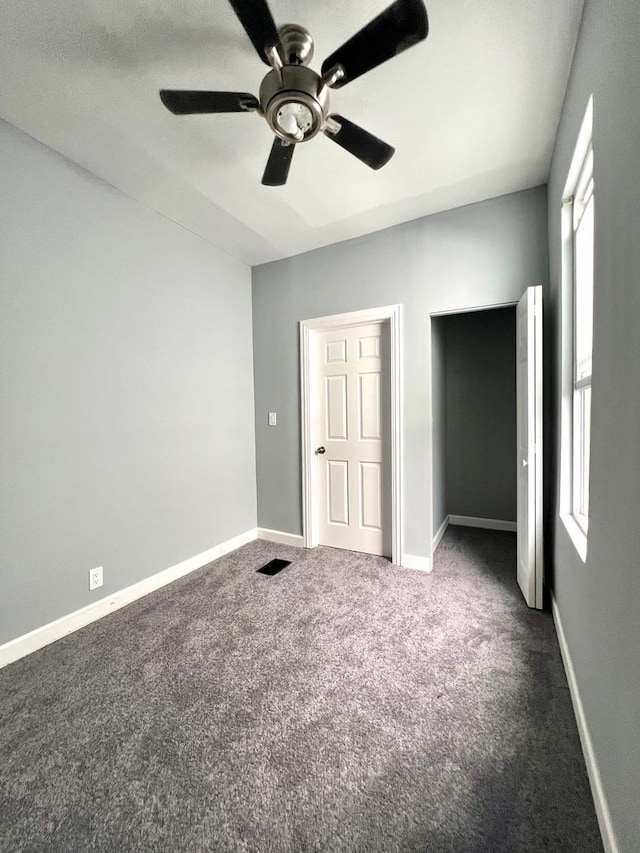 2245 S Homan Ave, Chicago, IL 60623 - unfurnished bedroom featuring visible vents, carpet flooring, a ceiling fan, and multiple windows