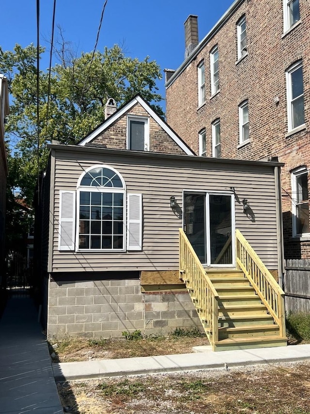 2245 S Homan Ave, Chicago, IL 60623 - rear view of house with a chimney and entry steps