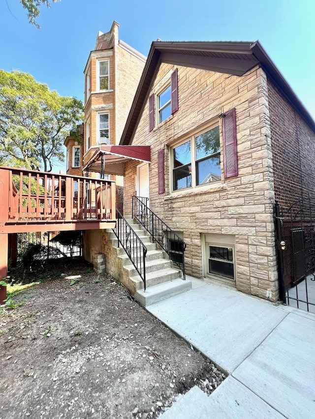 2245 S Homan Ave, Chicago, IL 60623 - view of front of property featuring stone siding and a deck