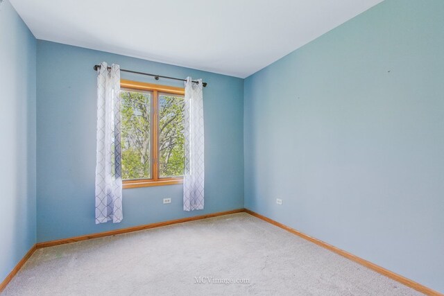 7841 W 157th St Unit 303, Orland Park, IL 60462 - carpeted spare room with baseboards
