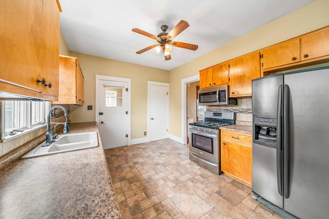 2523 Woods St, West Brooklyn, IL 61378 - kitchen with stainless steel appliances, a sink, baseboards, decorative backsplash, and a ceiling fan