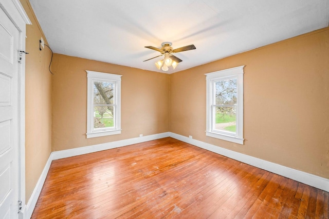 2523 Woods St, West Brooklyn, IL 61378 - spare room featuring hardwood / wood-style flooring, ceiling fan, and baseboards
