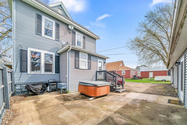 2523 Woods St, West Brooklyn, IL 61378 - rear view of property featuring fence, a hot tub, and a patio