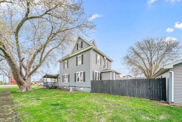 2523 Woods St, West Brooklyn, IL 61378 - view of home's exterior featuring fence, a yard, and cooling unit