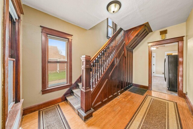 2523 Woods St, West Brooklyn, IL 61378 - staircase with ceiling fan, baseboards, and wood finished floors