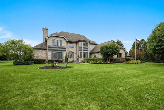 french country inspired facade featuring a chimney and a front lawn
