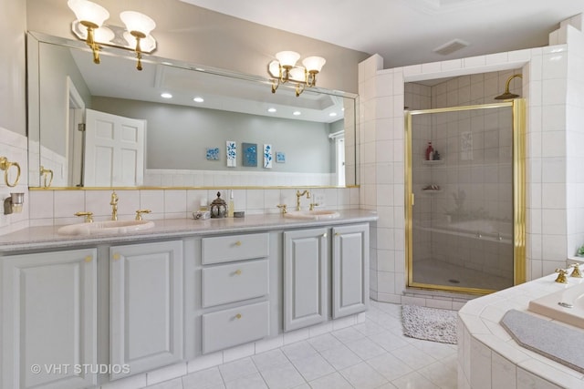 full bath featuring a sink, a stall shower, and a notable chandelier