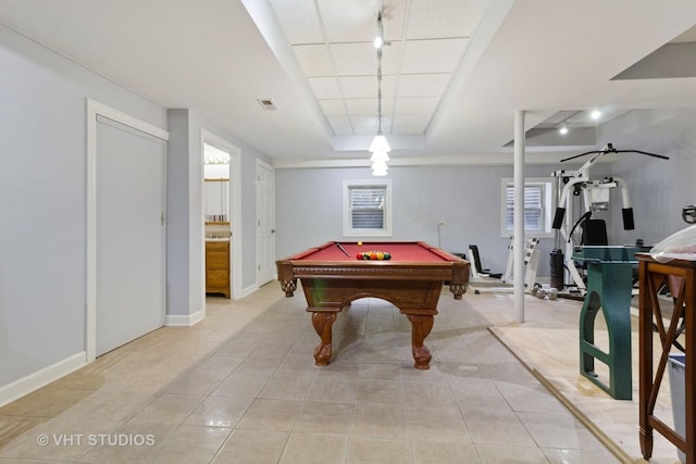 game room featuring visible vents, track lighting, light tile patterned floors, and a raised ceiling