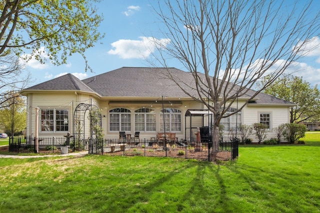 7160 Bannockburn Cir, Lakewood, IL 60014 - rear view of house featuring a patio area, roof with shingles, fence, and a lawn