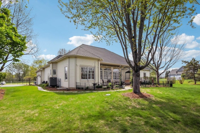 7160 Bannockburn Cir, Lakewood, IL 60014 - back of property featuring a yard, central AC unit, and fence