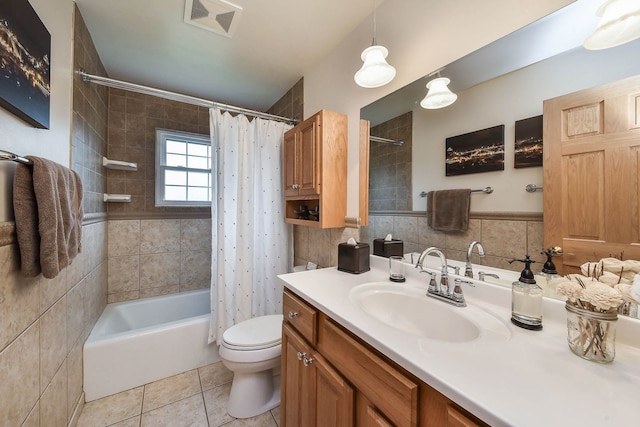 bathroom with visible vents, vanity, tile patterned floors, toilet, and shower / bathtub combination with curtain