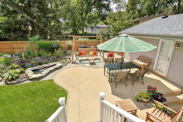 view of patio / terrace with outdoor dining area and a fenced backyard