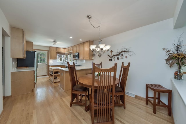 dining area with visible vents, a chandelier, recessed lighting, and light wood finished floors