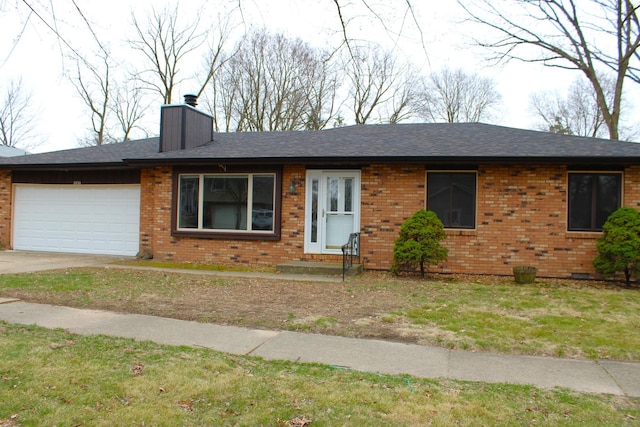 single story home featuring brick siding, an attached garage, a chimney, and driveway