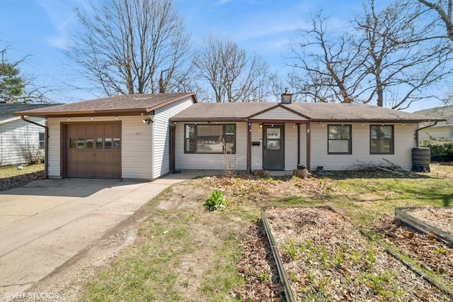 127 Tilton Park Dr, Dekalb, IL 60115 - single story home with concrete driveway, a chimney, and a garage